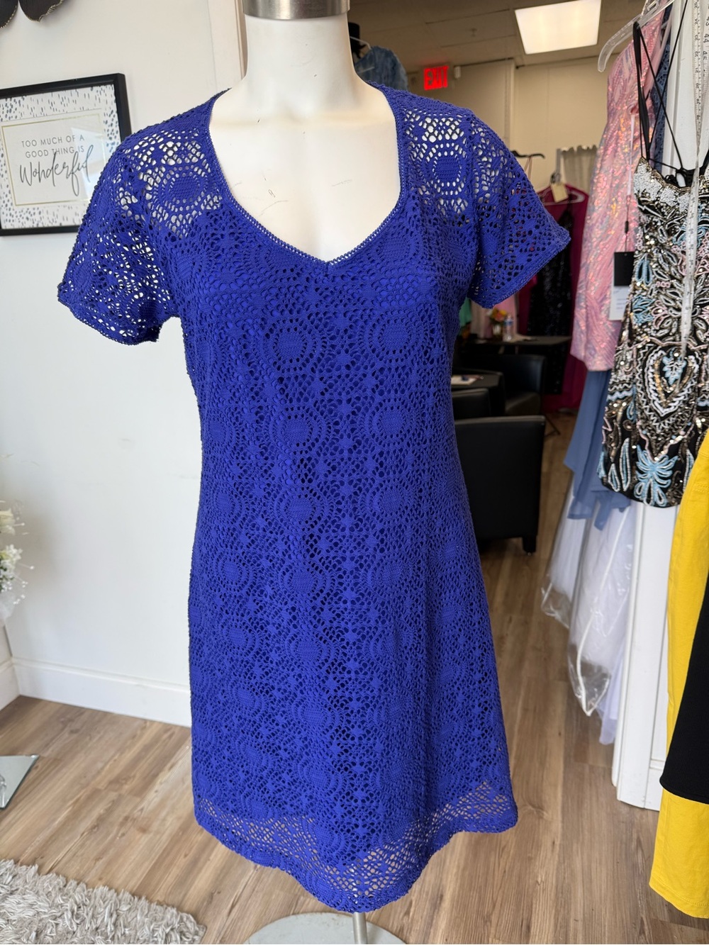 Women's blue crocheted garment with tags
